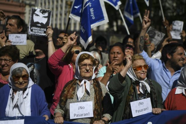 The octogenarian Mothers of Plaza de Mayo, heads covered with white handkerchieves, are jo