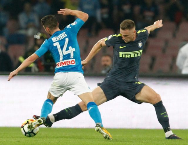 Inter Milan's Milan Skriniar (R) fights for the ball with Napoli's Dries Mertens during th