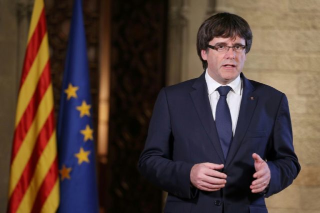 Catalan regional president Carles Puigdemont delivers a speech in Barcelona on October 21,