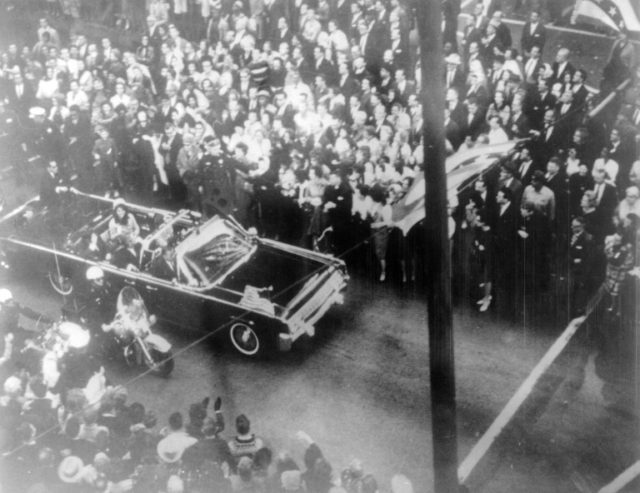 US President John F. Kennedy's motorcade drives through Dallas shortly before his assassin
