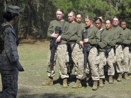 FILE - In this Feb. 21, 2013 file photo, female recruits stand at the Marine Corps Training Depot on Parris Island, S.C. The U.S. Marine Corps for the first time is eyeing a plan to let women attend what has been male-only combat training in Southern California, as officials work …