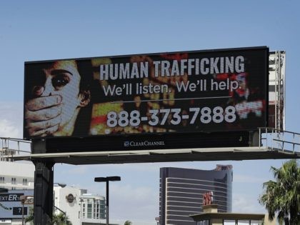A billboard displays a phone number for the National Human Trafficking Hotline, Thursday, Sept. 21, 2017, in Las Vegas. The FBI in Las Vegas is teaming with a billboard company to raise the profile in the fight to stop human trafficking in a state where brothels are legal in rural …