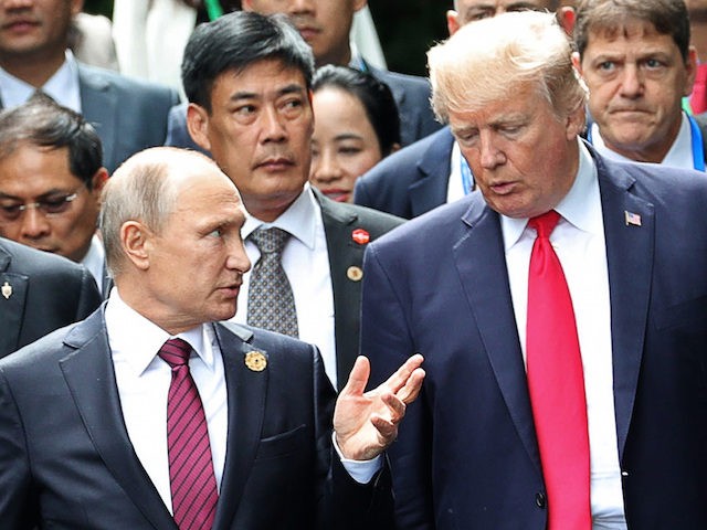 U.S. President Donald Trump, right, and Russia's President Vladimir Putin talk during
