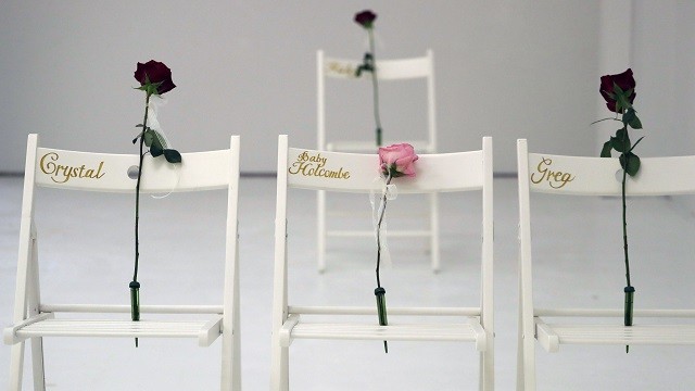 A memorial for the victims of the shooting at Sutherland Springs First Baptist Church includes 26 white chairs, each painted with a cross and and rose, is displayed in the church Sunday, Nov. 12, 2017, in Sutherland Springs, Texas. A man opened fire inside the church in the small South Texas community last week, killing more than two dozen. (AP Photo/Eric Gay)