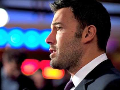 Director and actor Ben Affleck speaks with reporters at the premiere of his film Argo in Washington, Wednesday, Oct. 10, 2012. Argo is based on covert operation to rescue six Americans during the Iran hostage crisis in 1979. (AP Photo/Cliff Owen)