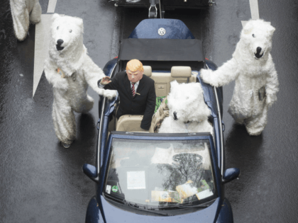 Demonstrators costumed as U.S. President Donald Trump and polar bears protest against the