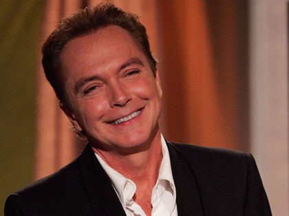 BEVERLY HILLS, CA - DECEMBER 1: Actors Danny Bonaduce, R, and David Cassidy prepare to giv