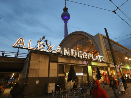 BERLIN, GERMANY - OCTOBER 16: People walk by the S-Bahn commuter train station at Alexanderplatz as the broadcast tower looms overhead near the site where Jonny, 20, was brutally beaten by an unidentified group in the early hours of October 14 on October 16, 2012 in Berlin, Germany. Jonny later …