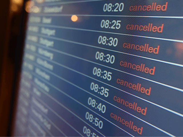 A departure board at the airport in Hamburg, northern Germany displays all flights as canc