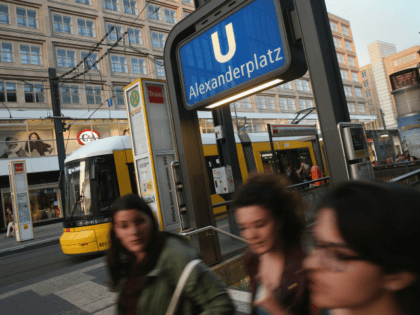 BERLIN, GERMANY - JUNE 18: Young women speaking French walk past the entrance to an U-Bahn