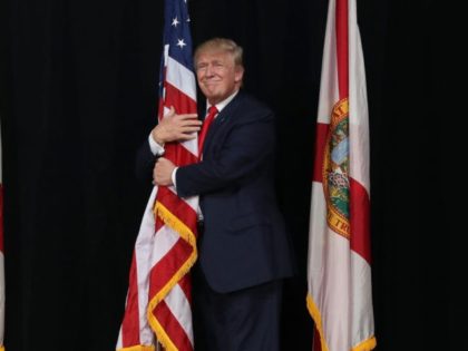 TAMPA, FL - OCTOBER 24: Republican presidential candidate Donald Trump hugs the America