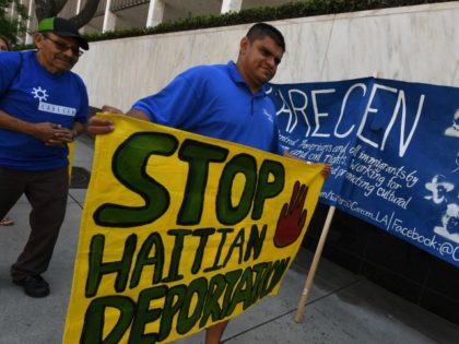 Campaigners march during a 'National Day of Action' to defend Temporary Protecte