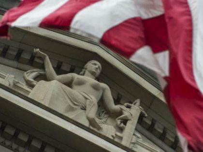 The US national flag is seen flying over a statue on the Department of Justice at the end of the work day in Washington, DC on July 27, 2017. US President Donald Trump has attacked US Attorney General Jeff Sessions this week, calling him "VERY weak" in pursuing intelligence leaks …