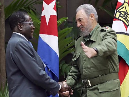 Zimbabwean President Robert Mugabe (L) is welcomed by Cuban President Fidel Castro at the