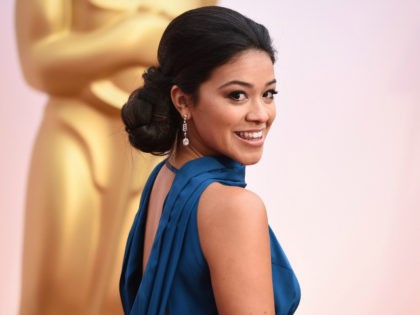 Gina Rodriguez arrives at the Oscars on Sunday, Feb. 22, 2015, at the Dolby Theatre in Los Angeles. (Photo by Jordan Strauss/Invision/AP)