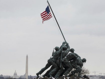 WASHINGTON, USA - MARCH 14: Snow falls on the Iwo Jima Memorial and the National Mall behi