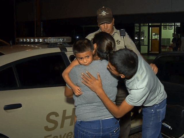 Josue Gonzalez returned to his parents by Fayette County Sheriff's Deputy.