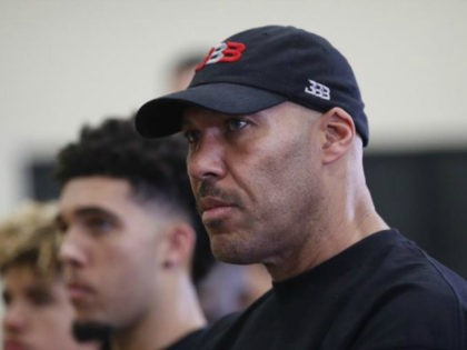 LaVar Ball, center, father of Los Angeles Lakers draft pick Lonzo Ball, listens to his son during a news conference, Friday, June 23, 2017, in El Segundo, Calif. (AP Photo/Jae C. Hong)