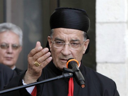 Lebanese Maronite patriarch Beshara Rai (C) speaks at a reception in Notre Dame Center in