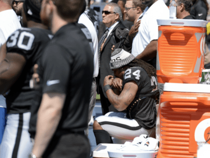 Oakland Raiders running back Marshawn Lynch (24) sits during the national anthem before an NFL football game between the Raiders and the Tennessee Titans Sunday, Sept. 10, 2017, in Nashville, Tenn. (AP Photo/Mark Zaleski)