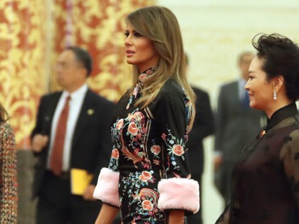 U.S. President Donald Trump, accompanied by U.S. first lady Melania Trump, second from right, and Chinese first lady Peng Liyuan, right, arrives for a state dinner at the Great Hall of the People, Thursday, Nov. 9, 2017, in Beijing. Trump is on a five-country trip through Asia traveling to Japan, …