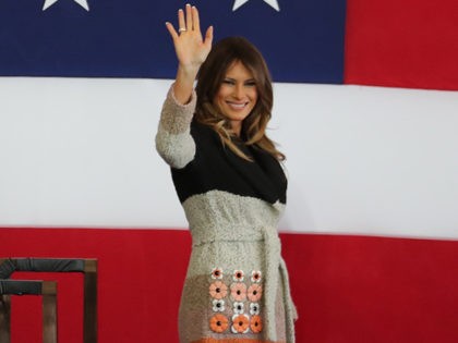 U.S. President Donald Trump, left, and first lady Melania Trump, right, greet the U.S. mil