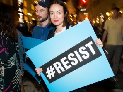 Olivia Wilde joins Michael Moore as he leads his Broadway audience to Trump Tower to prote