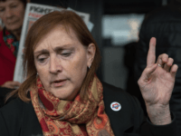 Britain's opposition Labour Party MP for Kensinton, Emma Dent Coad, gestures as she leaves after attending the opening statements for the Inquiry into the Grenfell Tower fire disaster, in London on September 14, 2017. An inquiry into the June 14, 2017 Grenfell Tower fire disaster opened on Thursday with a …