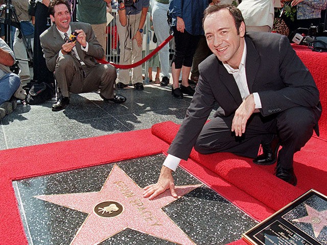 HOLLYWOOD, : US actor Kevin Spacey touches the star he received during ceremony on the fam