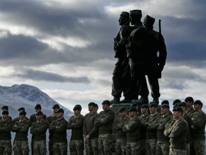SPEAN BRIDGE, UNITED KINGDOM - NOVEMBER 11: Serving servicemen and veterans gather at Commando Memorial, Spean Bridge where they observed a two minute silence as a mark of respect for the war dead on November 11, 2017 in Spean Bridge, Scotland. Armistice Day traditionally marks the end of the WWI …