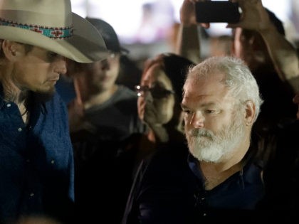 Stephen Willeford, right and Johnnie Langendorff, left, attend a vigil for the victims of the First Baptist Church shooting Monday, Nov. 6, 2017, in Sutherland Springs, Texas. Willeford shot suspect Devin Patrick Kelley, and Langendorff drove the truck while chasing Kelley. Kelley had opened fire inside the church in the …