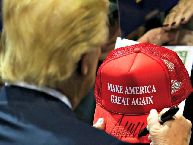 Trump Holds MAGA Hat