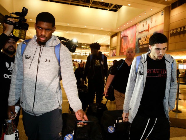 UCLA basketball players Cody Riley, left, LiAngelo Ball, right, and Jalen Hill, background