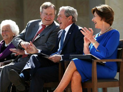 DALLAS, TX - APRIL 25: Former U.S. President George W. Bush (3rd L) shaks hands with his f