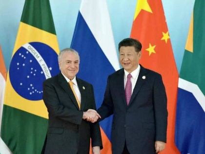 XIAMEN, CHINA - SEPTEMBER 04: Chinese President Xi Jinping (R) shakes hands with Brazil's President Michel Temer before the group photo during the BRICS Summit at Xiamen International Conference and Exhibition Centre on September 4, 2017 in Xiamen, China. The 9th BRICS summit is held from Sep 3 to 5 …