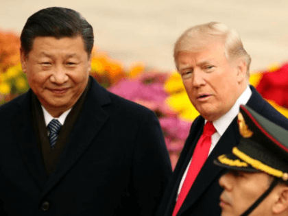 President Donald Trump and Chinese President Xi Jinping participate in a welcome ceremony
