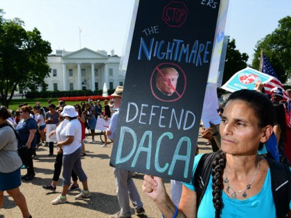 WASHINGTON, DC - SEPTEMBER 05: Jill Weiler holds a sign in support of DACA as she and others prepare to march from the White House on Tuesday September 05, 2017 in Washington, DC. (Photo by Matt McClain/The Washington Post via Getty Images)