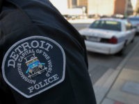 detroit-police-officer-car-getty The emblem for the Detroit Police Department is seen on the sleeve of an officer outside of the Theodore Levin U.S. Courthouse in Detroit, Michigan, U.S., on Wednesday, July 24, 2013. Detroit began its first court hearing after filing the biggest U.S. municipal bankruptcy. The city plans to seek a …