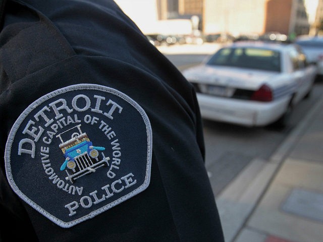 The emblem for the Detroit Police Department is seen on the sleeve of an officer outside o