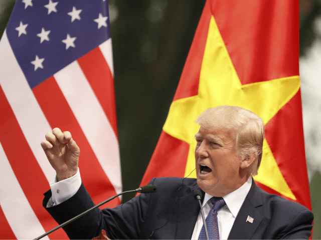 In this Nov. 12, 2017 file photo, President Donald Trump speaks during a news conference at the Presidential Palace, in Hanoi, Vietnam. President Trump is offering to mediate in the South China Sea disputes, while his Chinese counterpart Xi Jinping is playing down China’s military buildup in the disputed waters. …
