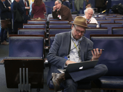 WASHINGTON, DC - FEBRUARY 24: New York Times reporter Glenn Thrush works in the Brady Briefing Room after being excluded from a press gaggle by White House Press Secretary Sean Spicer, on February 24, 2017 in Washington, DC. The New York Times, Los Angeles Times, CNN and Politico were also …