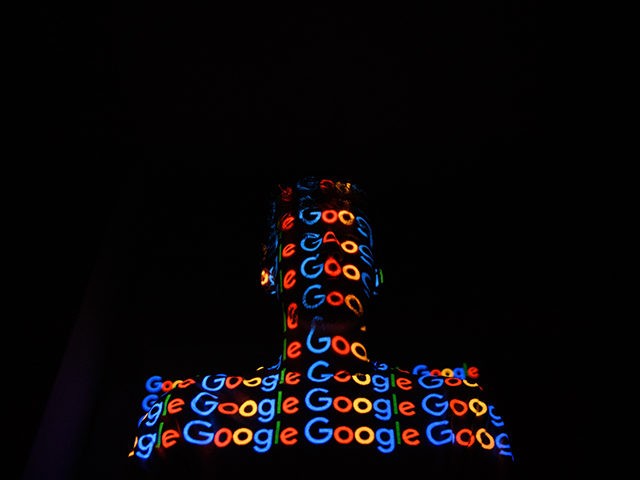 LONDON, ENGLAND - AUGUST 09: In this photo illustration, The Google logo is projected onto a man on August 09, 2017 in London, England. Founded in 1995 by Sergey Brin and Larry Page, Google now makes hundreds of products used by billions of people across the globe, from YouTube and …