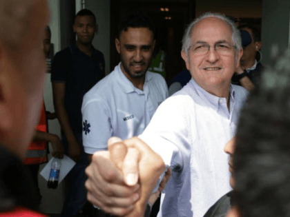 Ousted Caracas Mayor Antonio Ledezma greets a journalist before boarding a plane at El Dorado airport in Bogota, Colombia, Friday, Nov. 17, 2017. Ledezma, who was removed as mayor of Caracas and detained in 2015 on charges of plotting to oust President Nicolas Maduro, escaped house arrest and fled to …