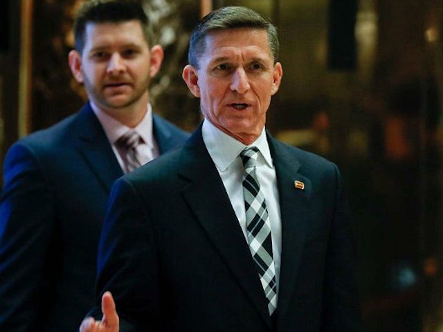 FILE - In this Nov. 17, 2016 file photo, Retired Lt. Gen Michael Flynn talks to media as he arrives with is son Michael G. Flynn, left, at Trump Tower in New York. Michael G. Flynn tweeted about the false idea that prompted a shooting at a Washington, D.C., pizza …