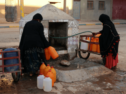 A Thursday Oct. 19, 2017 file photo of Moroccan women filling up containers with water fro