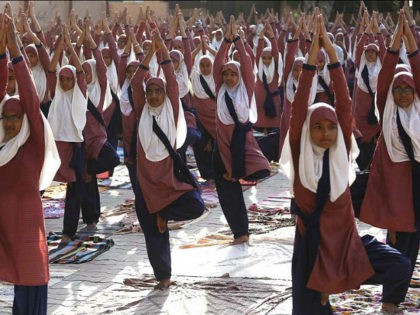 Indian Muslim students practice yoga ahead of International Yoga Day celebrations, at a school in Ahmadabad, India, Saturday, June 17, 2017. International Yoga Day will be celebrated on June 21. (AP Photo/Ajit Solanki)