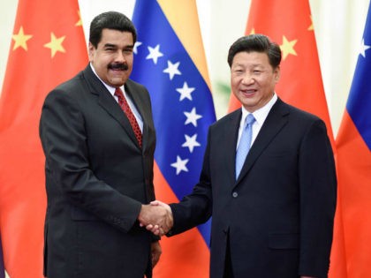 BEIJING, Sept. 1, 2015-- Chinese President Xi Jinping, right, meets with Venezuelan President Nicolas Maduro in Beijing, capital of China, Sept. 1, 2015. (Xinhua/Li Xueren via Getty Images)