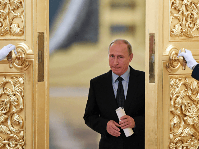 Russian President Vladimir Putin enters a hall to meet members of the Presidential Council