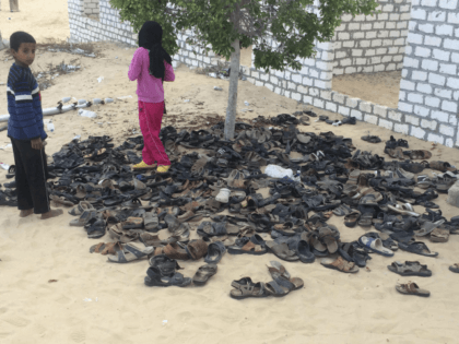 Discarded shoes of victims remain outside Al-Rawda Mosque in Bir al-Abd northern Sinai, Eg