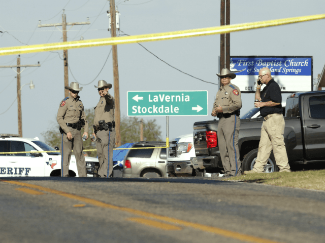 SUTHERLAND SPRINGS, TX - NOVEMBER 5: Law enforcement officials gather near First Baptist C